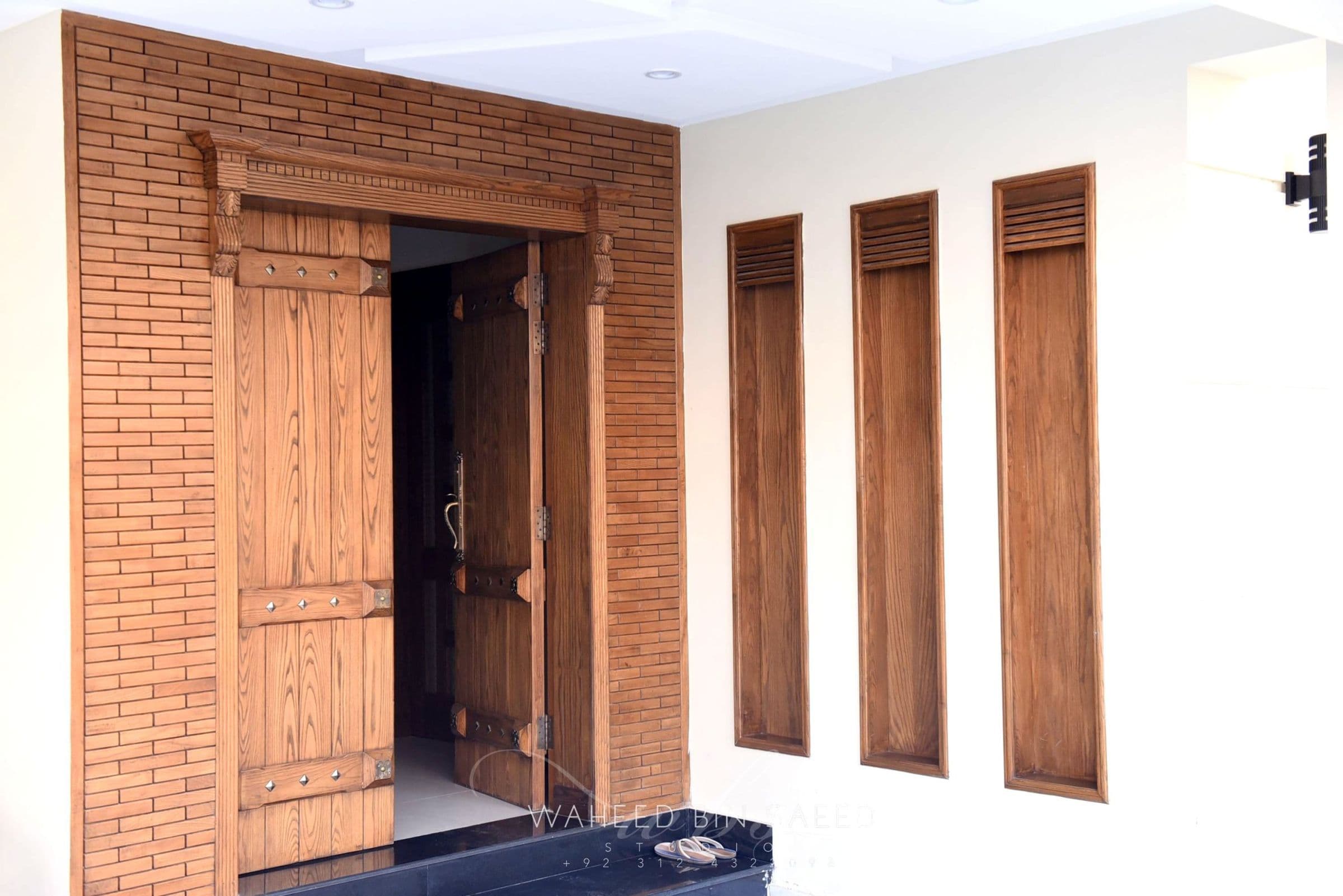 A hand-finished wooden entrance door